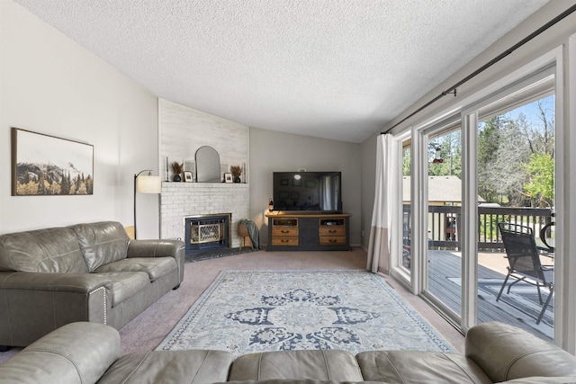 3114 W 20th Ave, Spokane, WA 99224 - carpeted living room with vaulted ceiling, a textured ceiling, and a brick fireplace