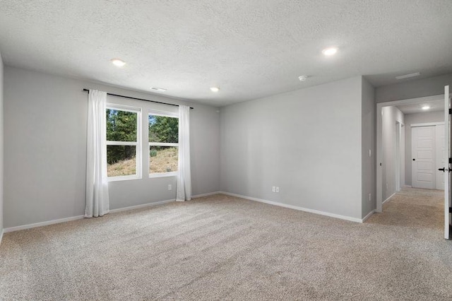 12413 E Dickens Ln, Spokane Valley, WA 99206 - unfurnished room featuring carpet, a textured ceiling, and recessed lighting