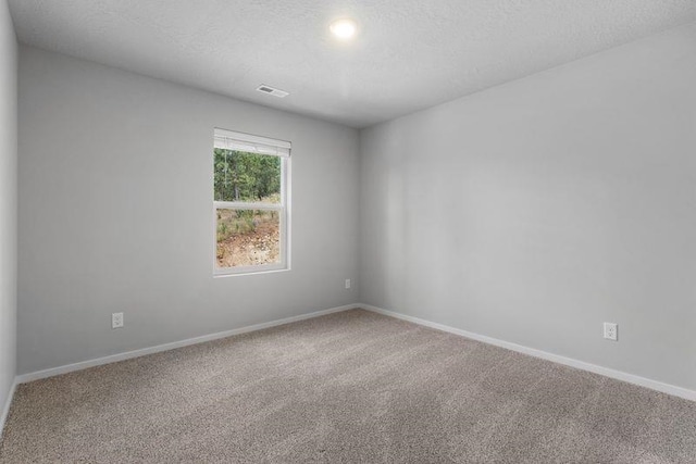12413 E Dickens Ln, Spokane Valley, WA 99206 - carpeted spare room featuring baseboards and a textured ceiling