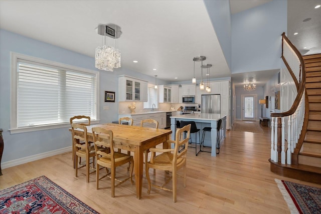 2605 S Cherrytree Ln, Spokane, WA 99203 - dining space featuring a chandelier, stairway, plenty of natural light, and recessed lighting