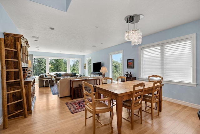 2605 S Cherrytree Ln, Spokane, WA 99203 - dining area with light wood-type flooring, plenty of natural light, and a chandelier