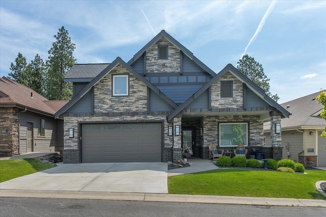 2605 S Cherrytree Ln, Spokane, WA 99203 - craftsman inspired home featuring stone siding, concrete driveway, a front lawn, and a garage