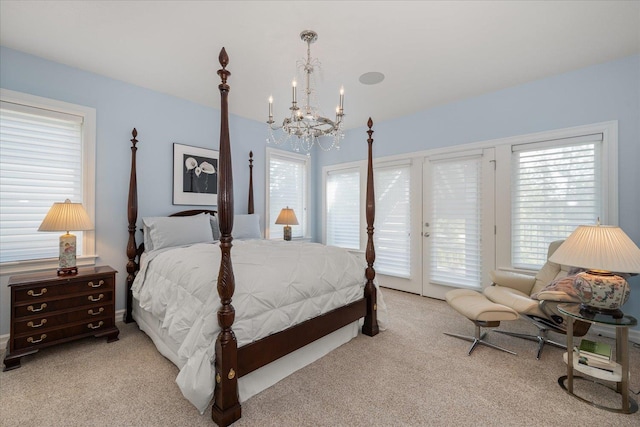 2605 S Cherrytree Ln, Spokane, WA 99203 - bedroom featuring access to outside, a chandelier, carpet flooring, and multiple windows