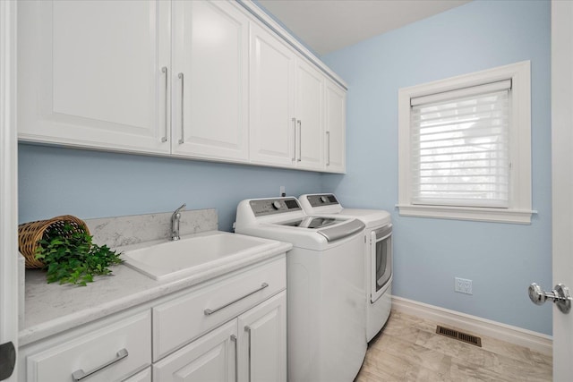 2605 S Cherrytree Ln, Spokane, WA 99203 - laundry area with cabinet space and washer and dryer