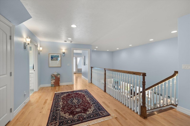 2605 S Cherrytree Ln, Spokane, WA 99203 - hallway with wood finished floors, an upstairs landing, recessed lighting, and a textured ceiling