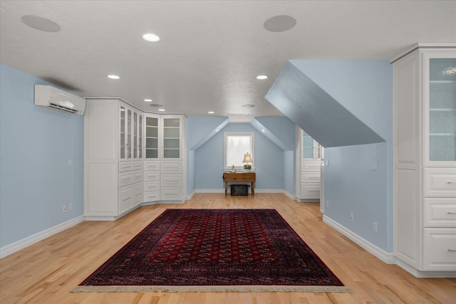 2605 S Cherrytree Ln, Spokane, WA 99203 - bonus room featuring a wall unit AC, light wood-type flooring, and recessed lighting