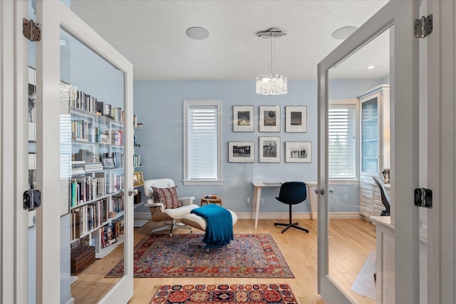 2605 S Cherrytree Ln, Spokane, WA 99203 - sitting room featuring wood finished floors, an office area, and a chandelier