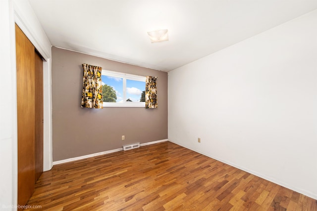 10914 E 7th Ave, Spokane Valley, WA 99206 - unfurnished bedroom featuring wood finished floors and a closet