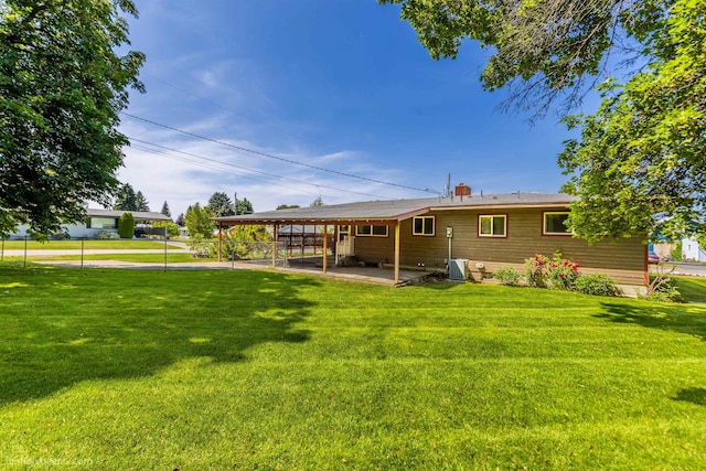 10914 E 7th Ave, Spokane Valley, WA 99206 - back of property with a patio and a carport