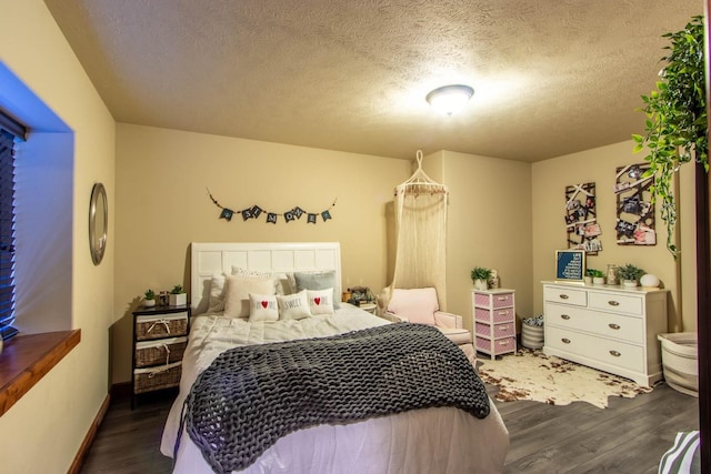 1119 N River Ridge Blvd, Spokane, WA 99224 - bedroom with dark wood-style flooring and a textured ceiling