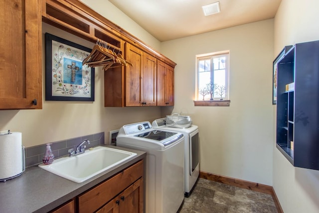1119 N River Ridge Blvd, Spokane, WA 99224 - laundry area with cabinet space, washer and dryer, and stone finish flooring