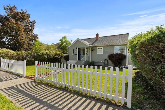 5130 N Stevens St, Spokane, WA 99205 - view of front of property with a fenced front yard, a chimney, and a shingled roof