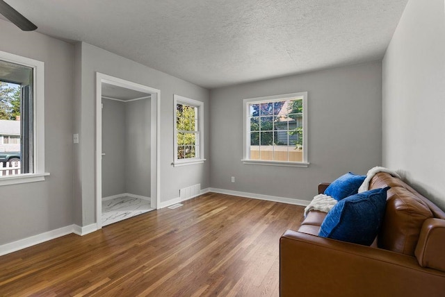 5130 N Stevens St, Spokane, WA 99205 - sitting room featuring wood finished floors and a textured ceiling