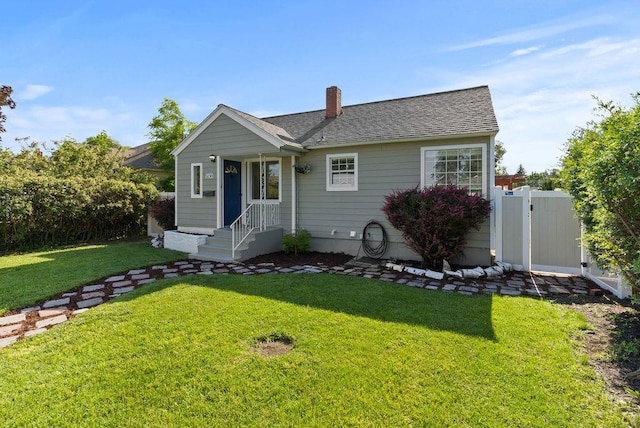 5130 N Stevens St, Spokane, WA 99205 - bungalow-style home with a front lawn, roof with shingles, a gate, and a chimney