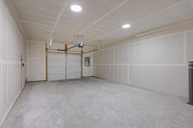 2009 W 9th Ave, Spokane, WA 99204 - garage with electric panel, a garage door opener, and recessed lighting