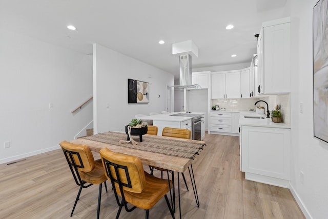 2009 W 9th Ave, Spokane, WA 99204 - dining space featuring light wood-type flooring, stairway, and recessed lighting