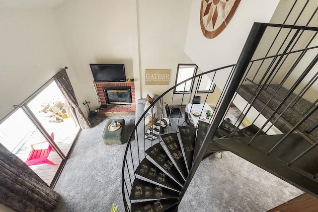 28600 N Mt Spokane Park Dr # 632, Mead, WA 99021 - staircase with a brick fireplace and a high ceiling