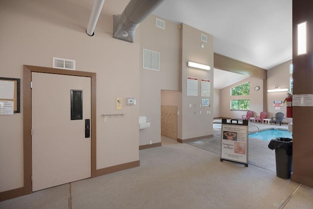 28600 N Mt Spokane Park Dr # 632, Mead, WA 99021 - kitchen featuring elevator, carpet flooring, and lofted ceiling