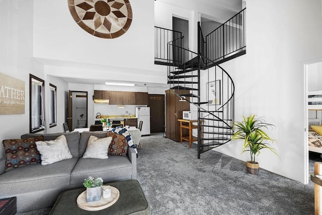 28600 N Mt Spokane Park Dr # 632, Mead, WA 99021 - living area with a towering ceiling, light colored carpet, and stairway