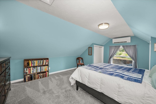 337 E 20th Ave, Spokane, WA 99203 - bedroom with a wall mounted air conditioner, carpet floors, and vaulted ceiling