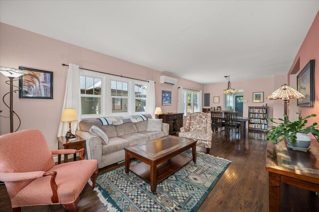 337 E 20th Ave, Spokane, WA 99203 - living room with a wall mounted AC and dark wood-style flooring