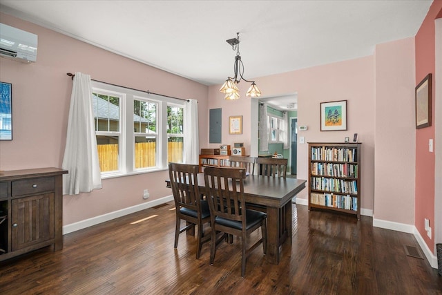 337 E 20th Ave, Spokane, WA 99203 - dining room with a wall unit AC and dark wood-style floors