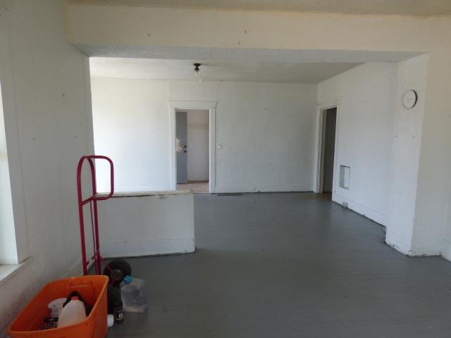 1727 E Riverside Ave, Spokane, WA 99202 - empty room with finished concrete floors