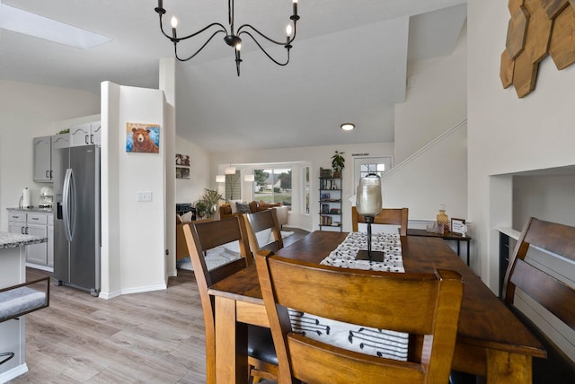 3205 S Mcdonald St, Spokane Valley, WA 99206 - dining area featuring lofted ceiling, light wood-style floors, and a chandelier