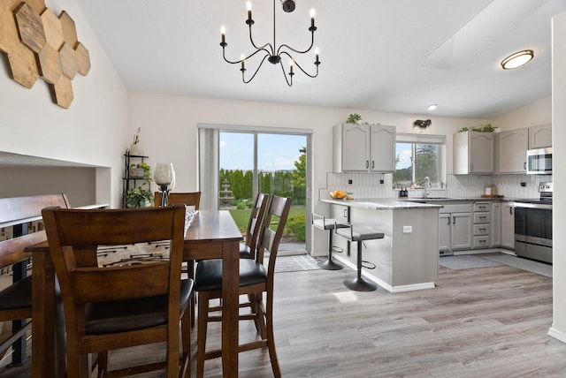 3205 S Mcdonald St, Spokane Valley, WA 99206 - dining space with light wood-style flooring and a chandelier