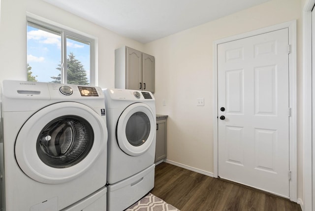 3205 S Mcdonald St, Spokane Valley, WA 99206 - laundry room featuring washer and clothes dryer, dark wood finished floors, and cabinet space