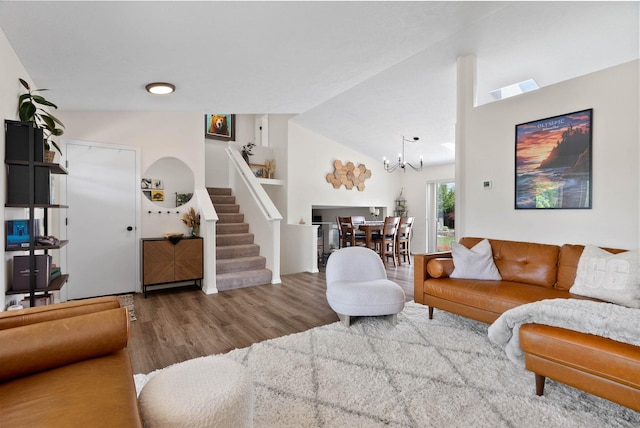 3205 S Mcdonald St, Spokane Valley, WA 99206 - living room with a chandelier, wood finished floors, stairway, and lofted ceiling