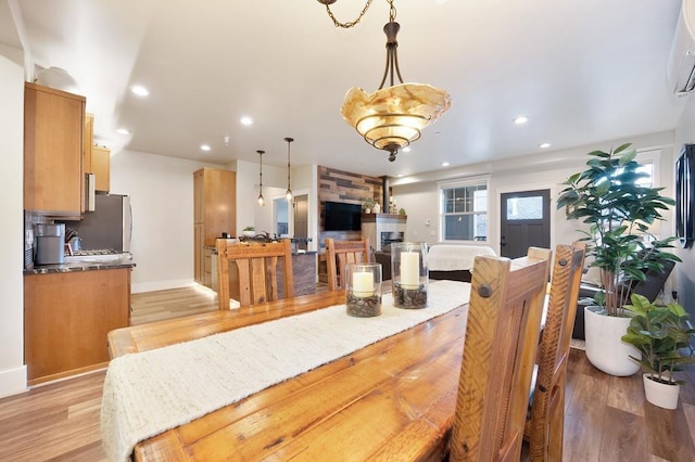 24493 E Pinnacle Ct # D, Liberty Lake, WA 99019 - dining space with recessed lighting, light wood-type flooring, and a wall unit AC