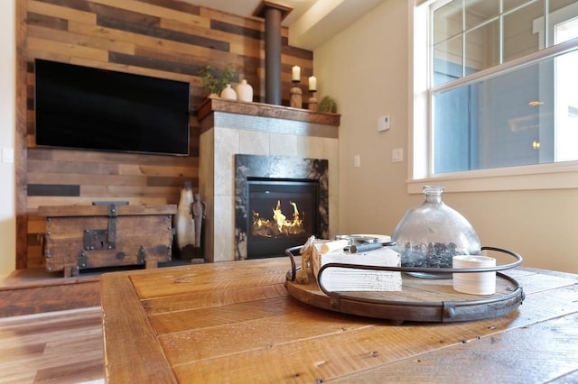 24493 E Pinnacle Ct # D, Liberty Lake, WA 99019 - living room with a tile fireplace, wood finished floors, and wooden walls