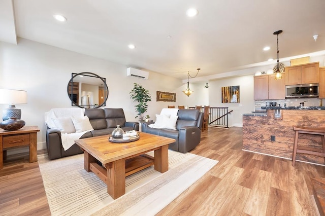 24493 E Pinnacle Ct # D, Liberty Lake, WA 99019 - living room with a wall mounted air conditioner, recessed lighting, and light wood finished floors