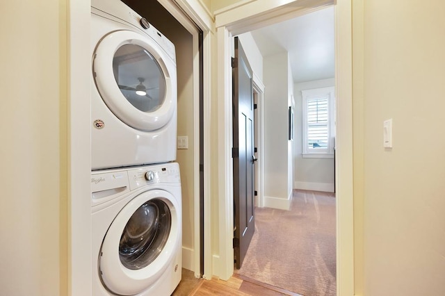 24493 E Pinnacle Ct # D, Liberty Lake, WA 99019 - laundry room with stacked washer / dryer and light colored carpet