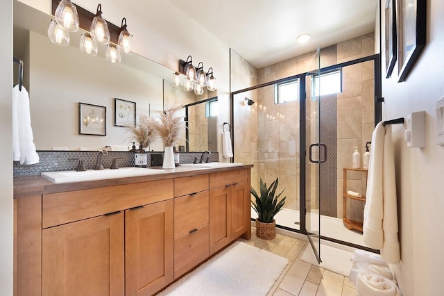 24493 E Pinnacle Ct # D, Liberty Lake, WA 99019 - full bath with double vanity, a shower stall, and tile patterned flooring