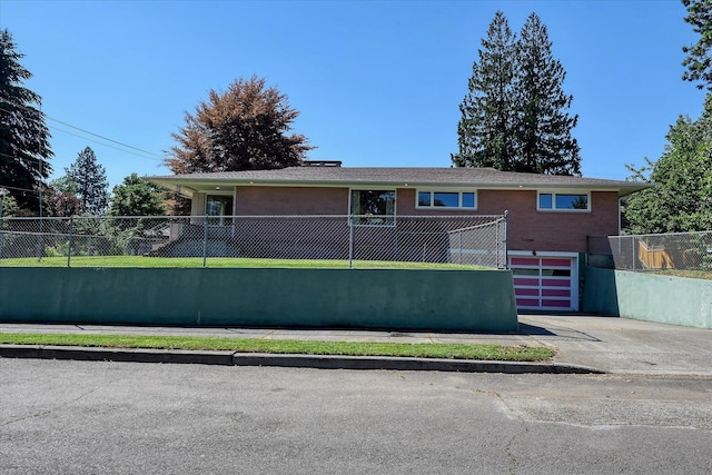 3303 W 8th Ave, Spokane, WA 99224 - view of front of home featuring driveway, a garage, and brick siding