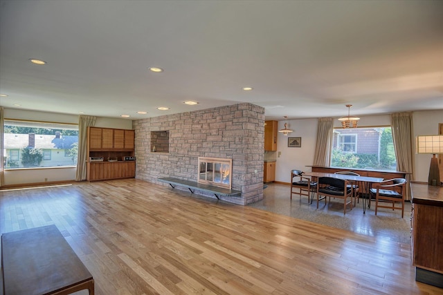 3303 W 8th Ave, Spokane, WA 99224 - living room with healthy amount of natural light, a fireplace, light wood-style floors, and recessed lighting