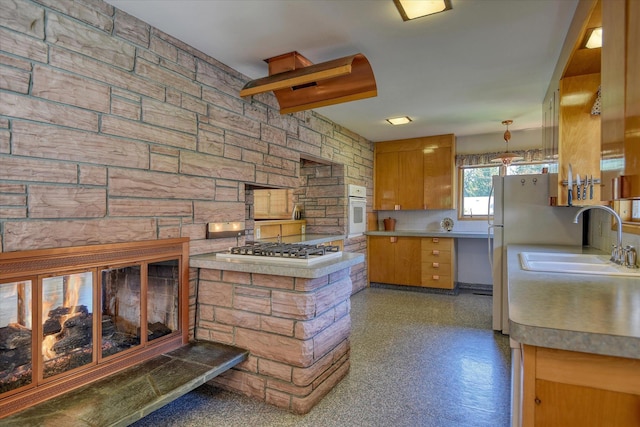 3303 W 8th Ave, Spokane, WA 99224 - kitchen featuring white appliances, brown cabinets, light countertops, and backsplash