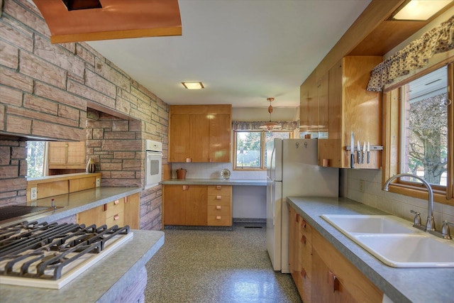 3303 W 8th Ave, Spokane, WA 99224 - kitchen featuring white appliances, plenty of natural light, tasteful backsplash, and light countertops