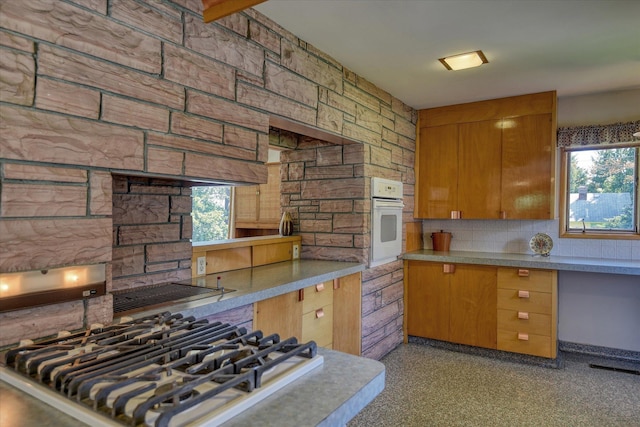 3303 W 8th Ave, Spokane, WA 99224 - kitchen with white oven, decorative backsplash, healthy amount of natural light, and stainless steel gas stovetop
