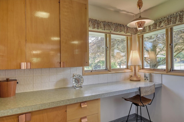 3303 W 8th Ave, Spokane, WA 99224 - kitchen with decorative backsplash, light countertops, and hanging light fixtures