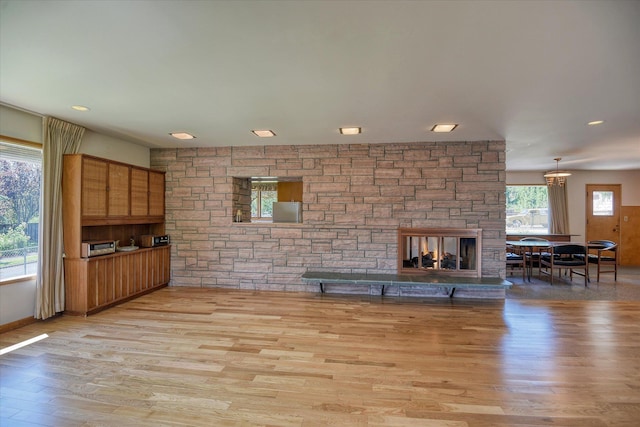 3303 W 8th Ave, Spokane, WA 99224 - living room featuring wood finished floors and a fireplace