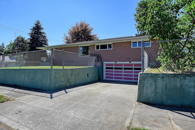 3303 W 8th Ave, Spokane, WA 99224 - ranch-style home featuring asphalt driveway, an attached garage, and brick siding