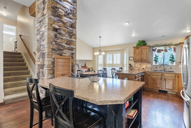 6709 S Moran View St, Spokane, WA 99224 - kitchen featuring a peninsula, dark wood-style floors, freestanding refrigerator, light countertops, and recessed lighting
