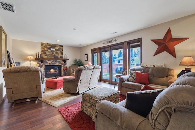 6709 S Moran View St, Spokane, WA 99224 - living room with dark wood-style floors, a stone fireplace, and recessed lighting