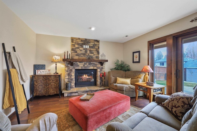 6709 S Moran View St, Spokane, WA 99224 - living area featuring healthy amount of natural light, dark wood-type flooring, and a fireplace