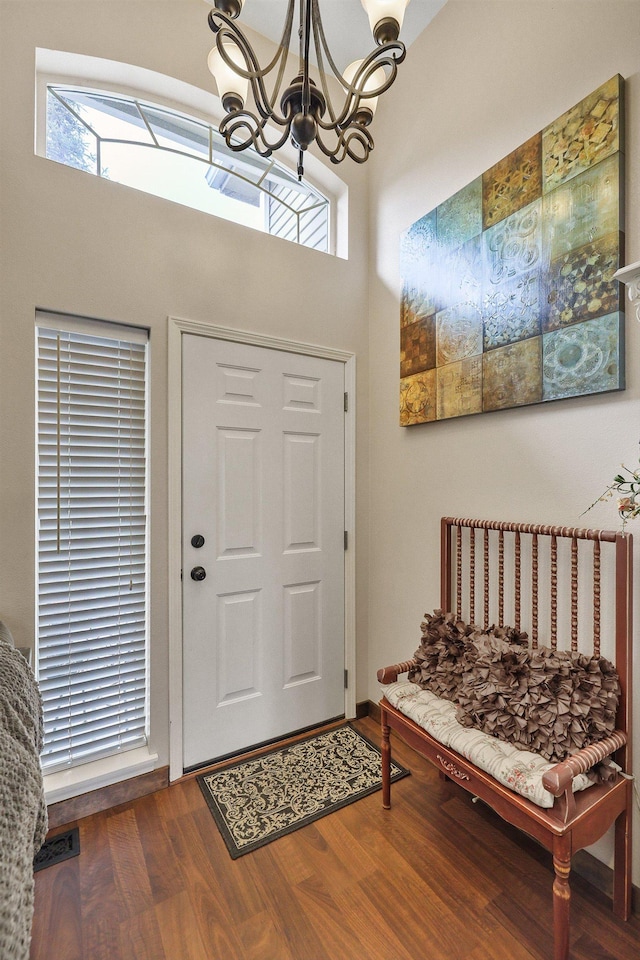 6709 S Moran View St, Spokane, WA 99224 - entrance foyer with a chandelier, dark wood-style flooring, healthy amount of natural light, and a high ceiling
