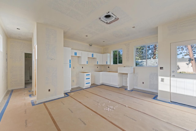 1324 W Dalke Ave Unit B, Spokane, WA 99205 - kitchen with baseboards and white cabinetry