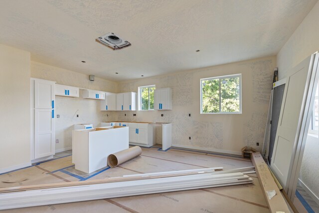 1324 W Dalke Ave Unit B, Spokane, WA 99205 - kitchen with white cabinetry and a center island